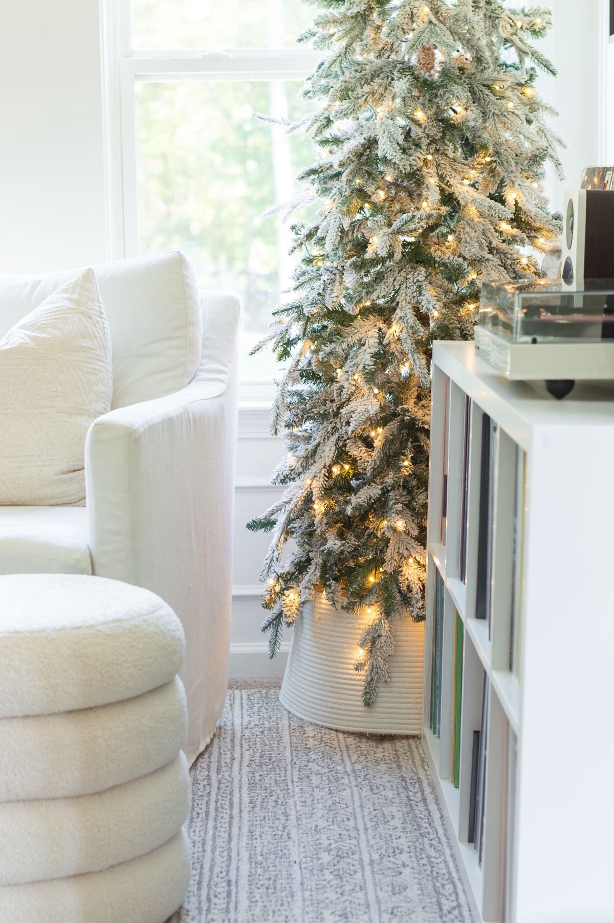I love having a Christmas tree in our bedroom during the season. This slim flocked tree is the perfect addition to my reading and listening nook. It’s so pretty that I leave the branches bare. home decor Christmas decor neutral bedroom area rug sitting area vinyl lover record player Christmas tree collar

#LTKStyleTip 

#LTKHoliday #LTKHome