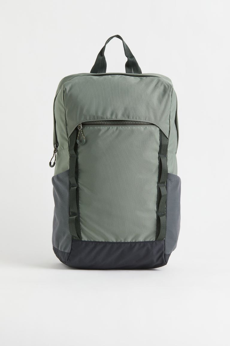 Conscious choice  Backpack in water-repellent, functional fabric. Padded, adjustable shoulder str... | H&M (US + CA)
