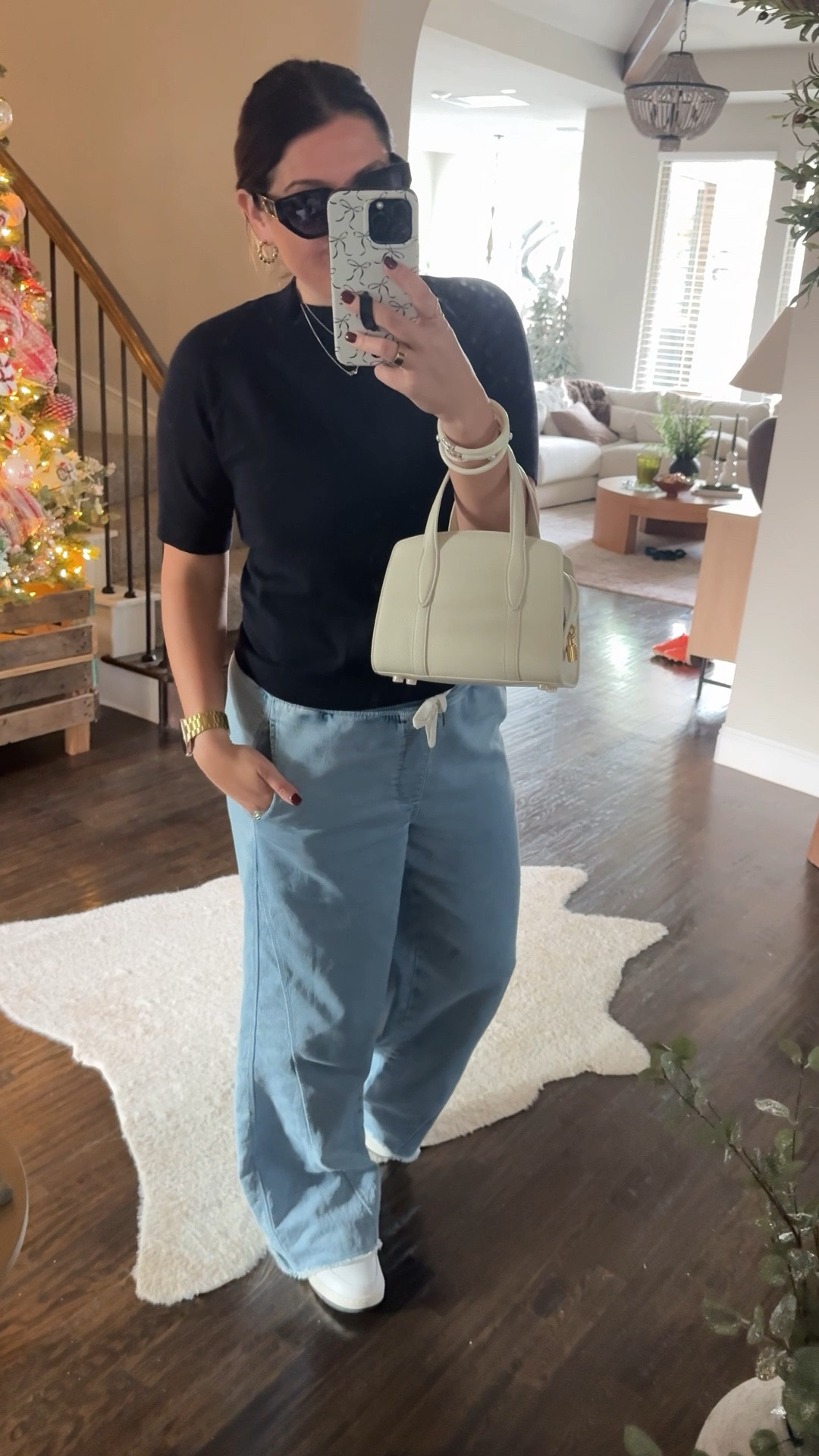 OOTD. Casual, comfy, but still put together! These wide leg trousers, although denim, feel like sweatpants! They’re so comfortable!! And on sale right now!! This exact bag is linked in my IG Black Friday highlights! Top is Mango and is the most gorgeous navy blue! 

#LTKSaleAlert #LTKgrwm #LTKmomlife