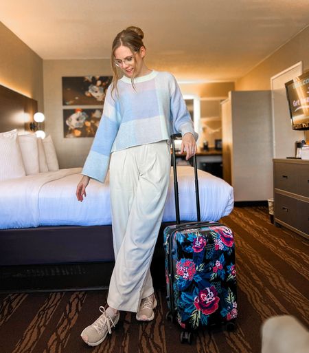 Simple and comfortable travel outfit | cropped bell sleeved sweater | wide leg white pants | floral hardside spinner luggage

#LTKfindsunder50 #LTKtravel #LTKstyletip