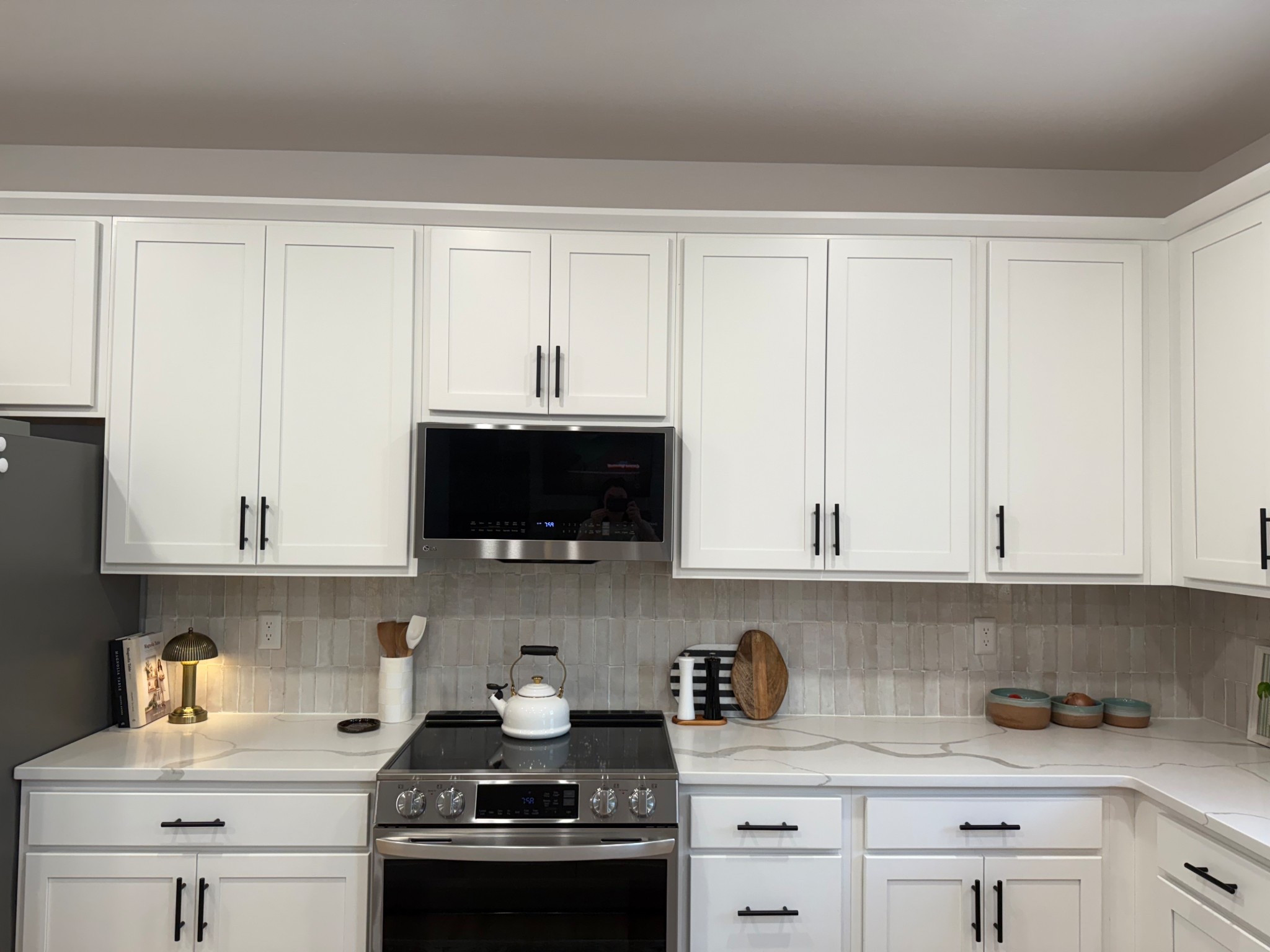 For our kitchen accessories I style with pieces we actually use. Think cutting boards or marble boards that you would use for charcuterie. Salt and pepper shakers, a mini lamp, cook books, a tea kettle. These are all things we have but when left out look intentional. 

#kitchen #backsplash #saltandpeppershakers #charcuterie #cuttingboards #marble #minilamp #vase #accessories #styled #intentional #teakettle

#LTKspring #LTKspringtrends #LTKHome