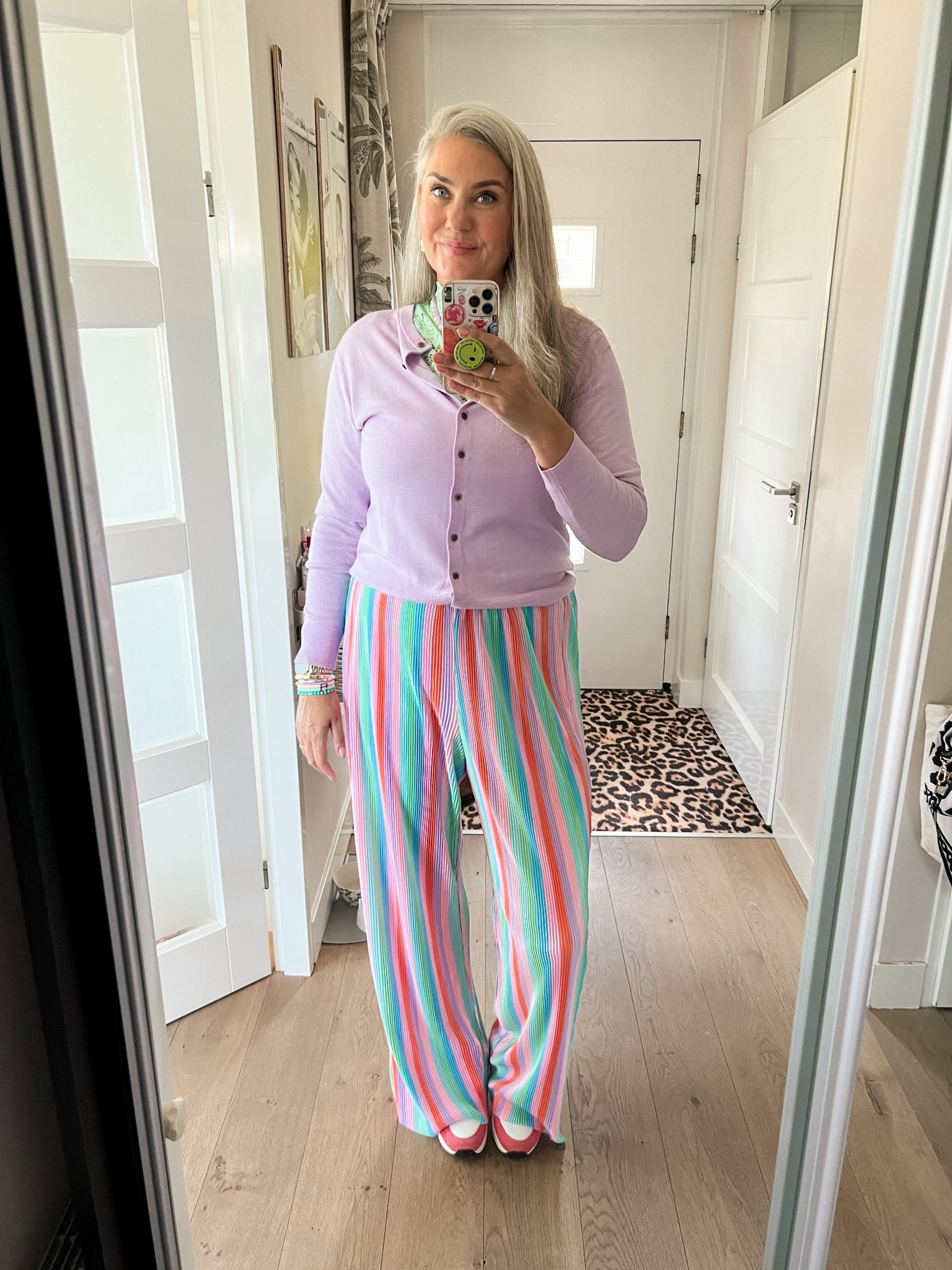 Ootd - Monday. Striped plissé trousers (Studio Poespas) paired with a lavender cardigan over a mint lace top (local boutique), glass bead necklace (Paulie Pocket) and green sea theme necklace. Pink and orange Skechers sneakers. 

#LTKspring #LTKeurope #LTKnederlands