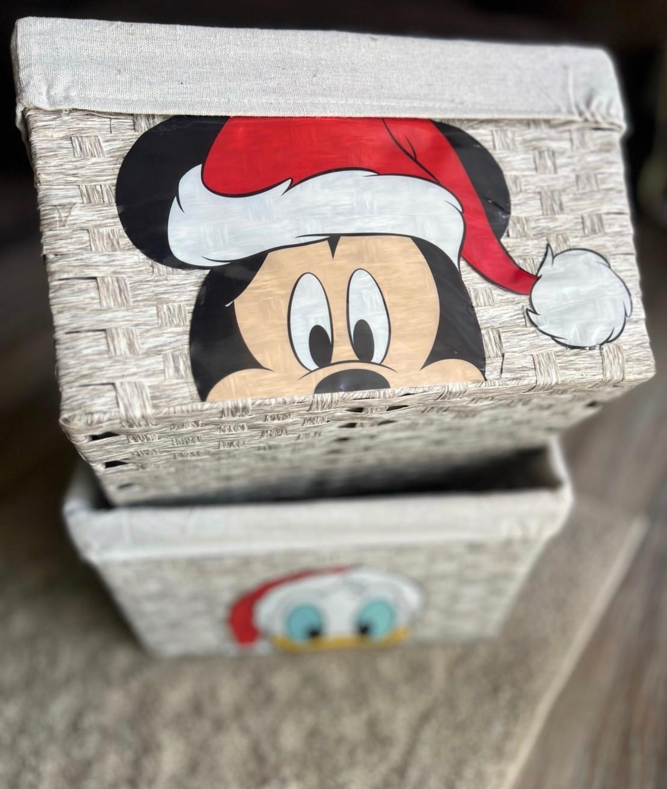 Disney Christmas Craft Idea!
Grab a couple of these hard plastic faux wicker baskets & hot glue on a Disney Christmas window cling very carefully. 

When I say gently, very gentle. Utilize a little trickle of glue to adhere the decals.

Optional: If the back side of your decal can stick with the heat from the glue gun, this method worked with a bit more patience required for it to stick. This way does crinkle the edges more so test and see what works for you. 

This image is soooooo the basic version 🤣! You can change out the lining to match your Christmas decor, add a ribbon trim, bows, foliage & berries, then trim with glitzy pine cones. 

Let’s chat fuller shall we: Cute faux birch logs, throw blankets, gifts, or as a planter for faux stems, you could even add scented vase filler or scent sachets.

Ooooo!!! You can sooo use this a counter / floor decor for mini trees! #LTKHoliday

#LTKHome #LTKSeasonal