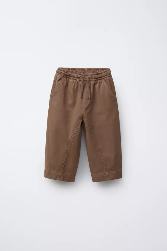 Pants with elastic waistband and adjustable front drawstring. Front pockets. Appliqué detail at ... | Zara US