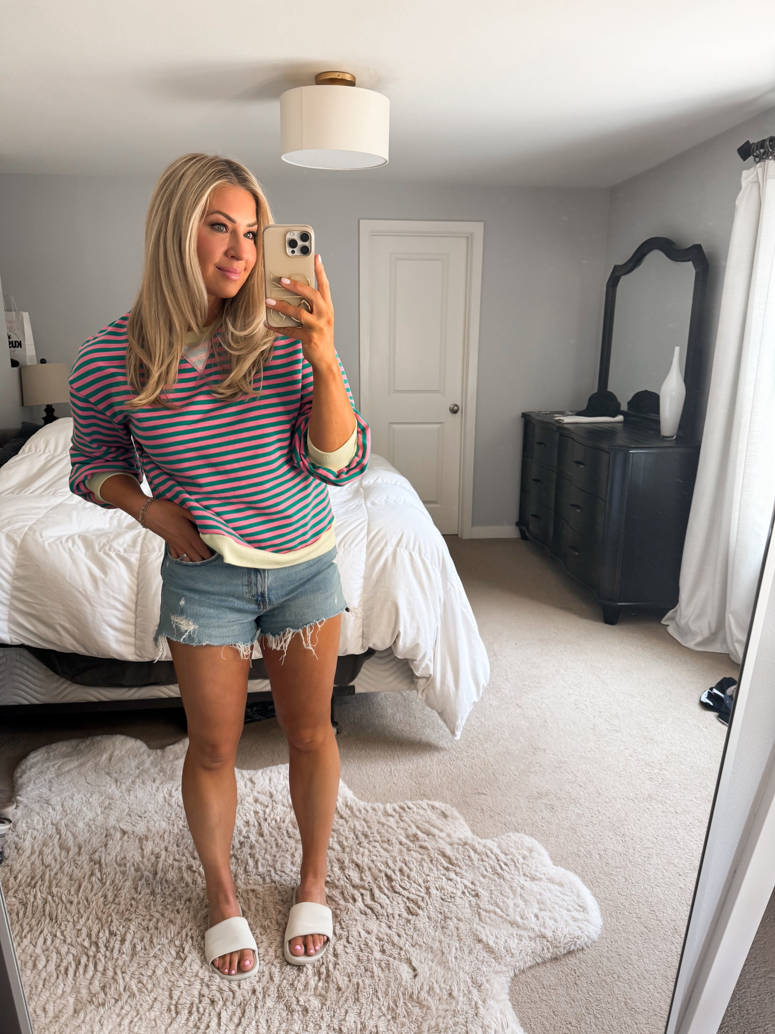 Casual summer outfit 
I would size up in this sweatshirt because it shrinks when you dry it. The arms are a little short too 
I sized up in the shorts
Slides tts 

#LTKSeasonal #LTKFindsUnder50 #LTKOver40