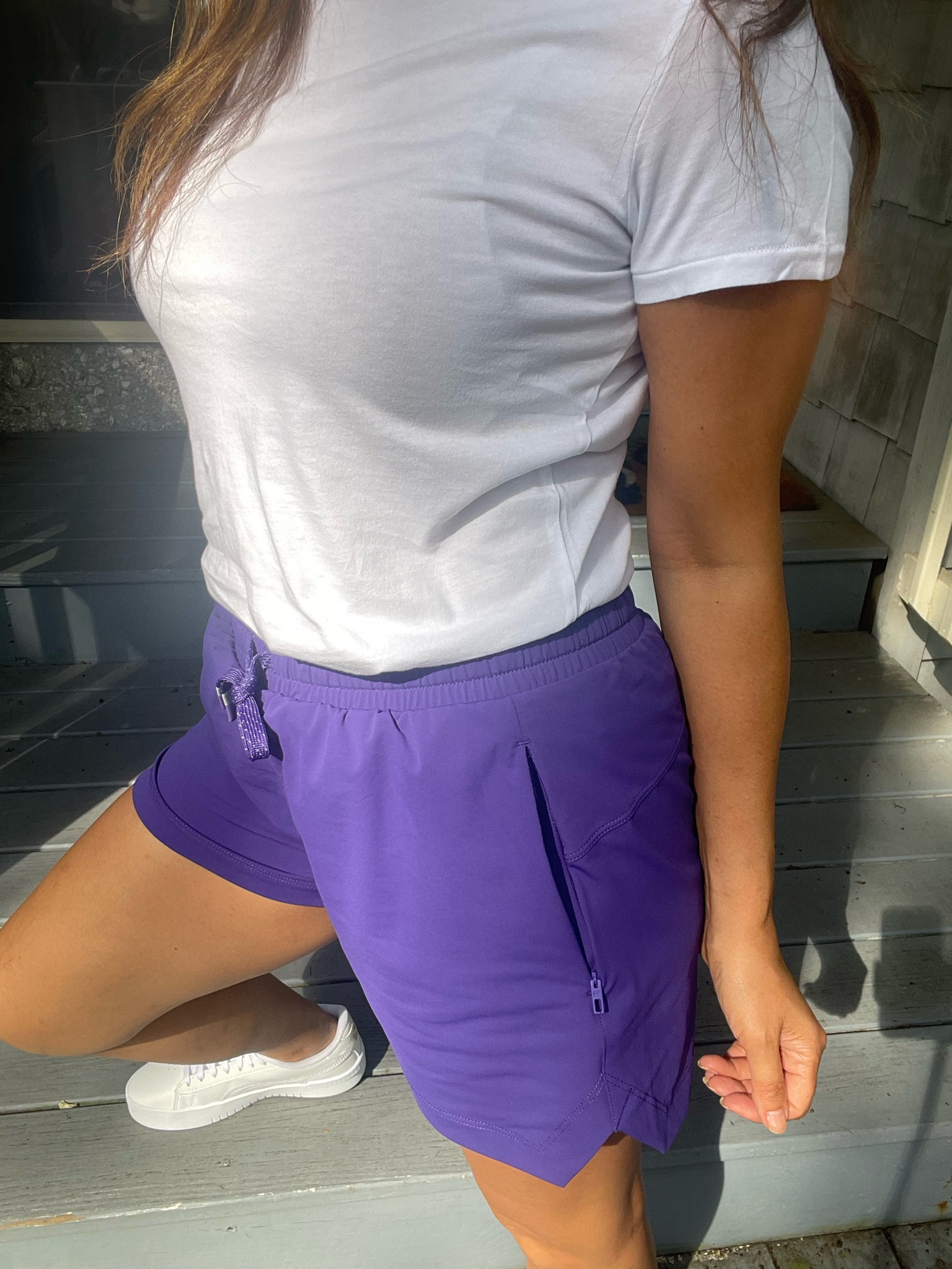 Fabletics Runner shorts in purple and white crewneck tee | I’m wearing small in both 

#LTKFitness #LTKstyletip #LTKunder50