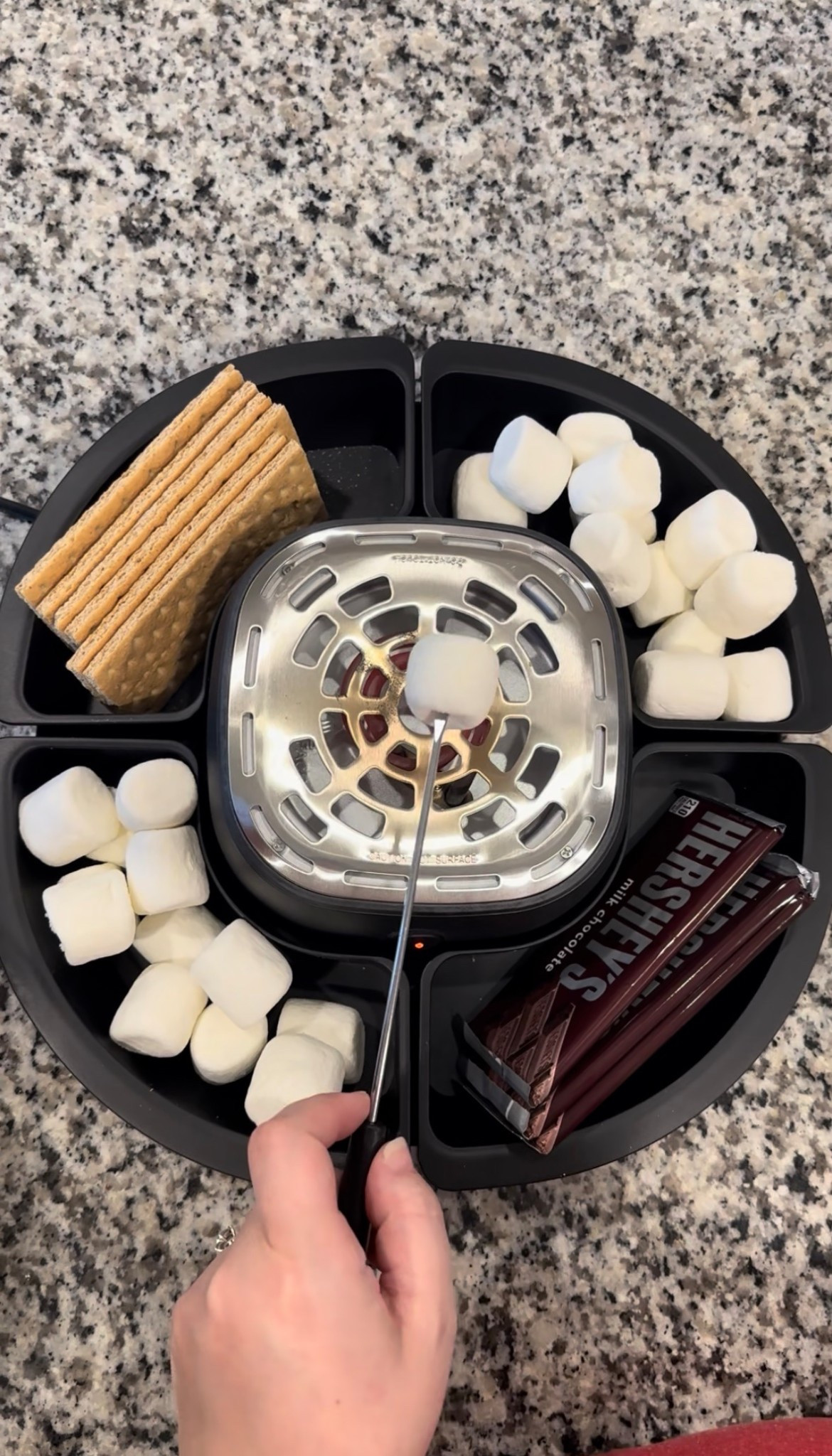 Is making s’mores on your summer bucket list? Then you definitely need this s’mores maker!

Turn your kitchen or backyard into a mini campfire with this electric s’mores maker — one of the most fun summer activities for kids at home! 🔥🍫 If you’re searching for summer toys for kids, family night ideas, or rainy day activities, this is such a fun addition to your home.

This electric marshmallow roaster lets kids safely toast marshmallows without an open flame, making it perfect for family movie nights, kids sleepovers, summer playdates, or weekend treats. My kids love building their own s’mores and it keeps them busy while making the sweetest memories together.

Perfect for anyone searching for:
• electric s’mores maker
• indoor summer activities for kids
• fun things to do with kids at home
• summer boredom busters for kids
• family night snack ideas
• kids kitchen gadgets
• unique gift ideas for kids

If you’re creating a summer bucket list with kids or looking for simple family activities, this is such a fun and easy way to bring the campfire experience home. 🍫🔥

#LTKSeasonal #LTKSpringSale #LTKdayinmylife