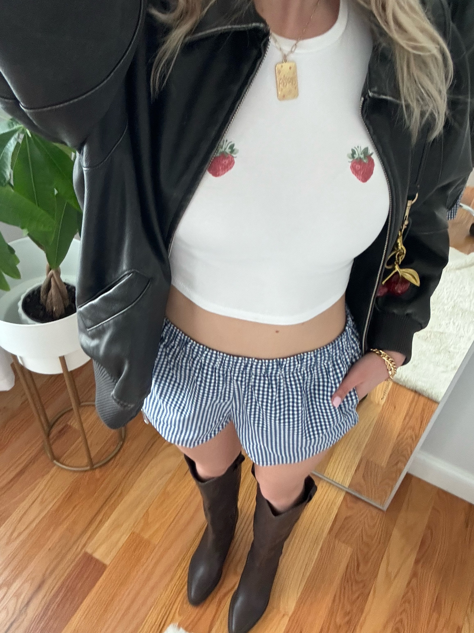 Baby tee is the Stormi tee from garage with the “two strawberries art” idk WHY i can’t find it on the garage website through LTK but just google it and you should be able to find it <3