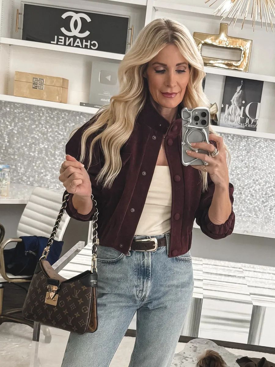 Hands down one of the coolest jackets I’ve found lately 😍 This burgundy suede bomber jacket is such a statement piece, and that high collar detail makes it feel super current for 2026. The cropped cut is so flattering because it hits right at the smallest part of your waist and instantly gives you that snatched shape. I’m wearing an XS in the jacket and a 24 in the jeans. 

 

#LTKootd #LTKSeasonal #LTKOver40