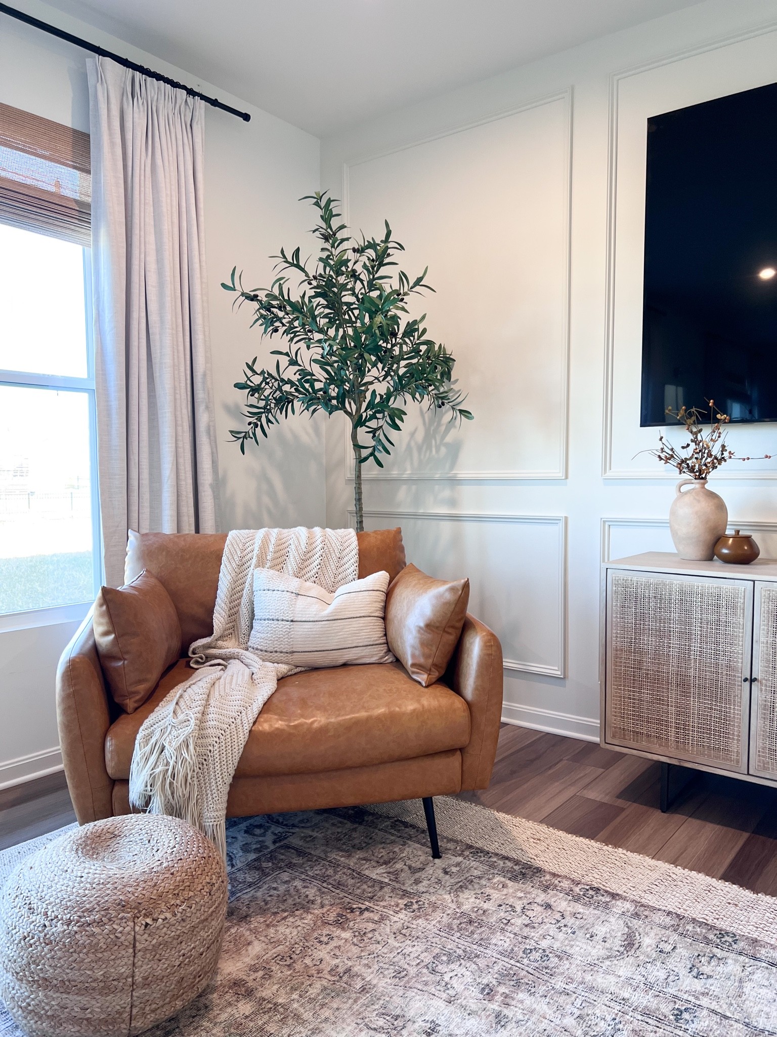 Amazon curtains and curtain rods are the best! 
Accent chair, throw blanket, accent pillows, tv console, sideboard, faux olive tree, bamboo shades, woven pouf 

#LTKhome #LTKunder100