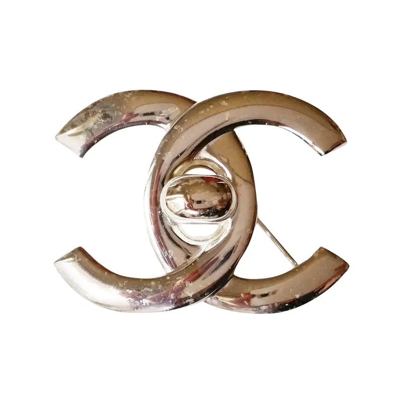 Authentic Chanel Silver Turnlock CC Brooch | Chairish