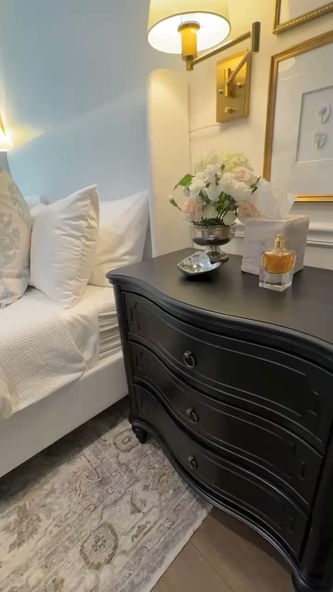 Classic bedroom decor, black wooden nightstand, black dresser, printed throw pillows, Jillien harbor pillow, white upholstered bed, black and white bedroom

#LTKHome