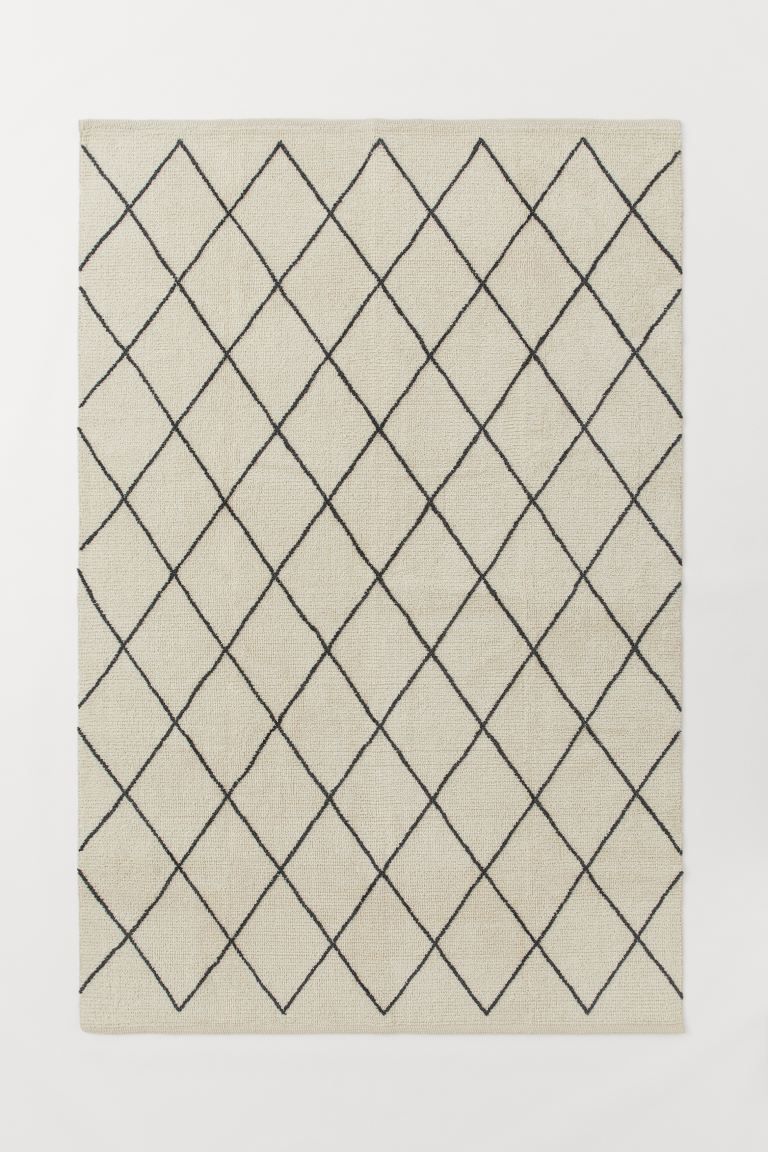 Large rug in a patterned cotton weave with short pile in a soft wool blend. | H&M (UK, MY, IN, SG, PH, TW, HK)