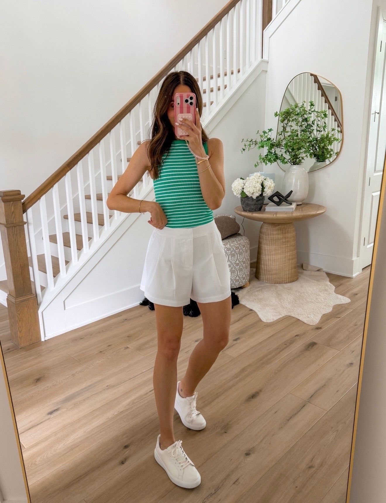 This outfit is giving country club meets casual weekend. The striped knit tank adds the perfect pop of color, and these tailored white shorts paired with classic white sneakers make it an easy summer outfit you’ll wear on repeat.

Striped tank, White shorts, Summer outfit, Casual chic, Resort style, White sneakers, Everyday outfit, Vacation style, Summer basics, Preppy style, Warm weather outfit, annabrstyle

#LTKootd #LTKTravel #LTKSeasonal