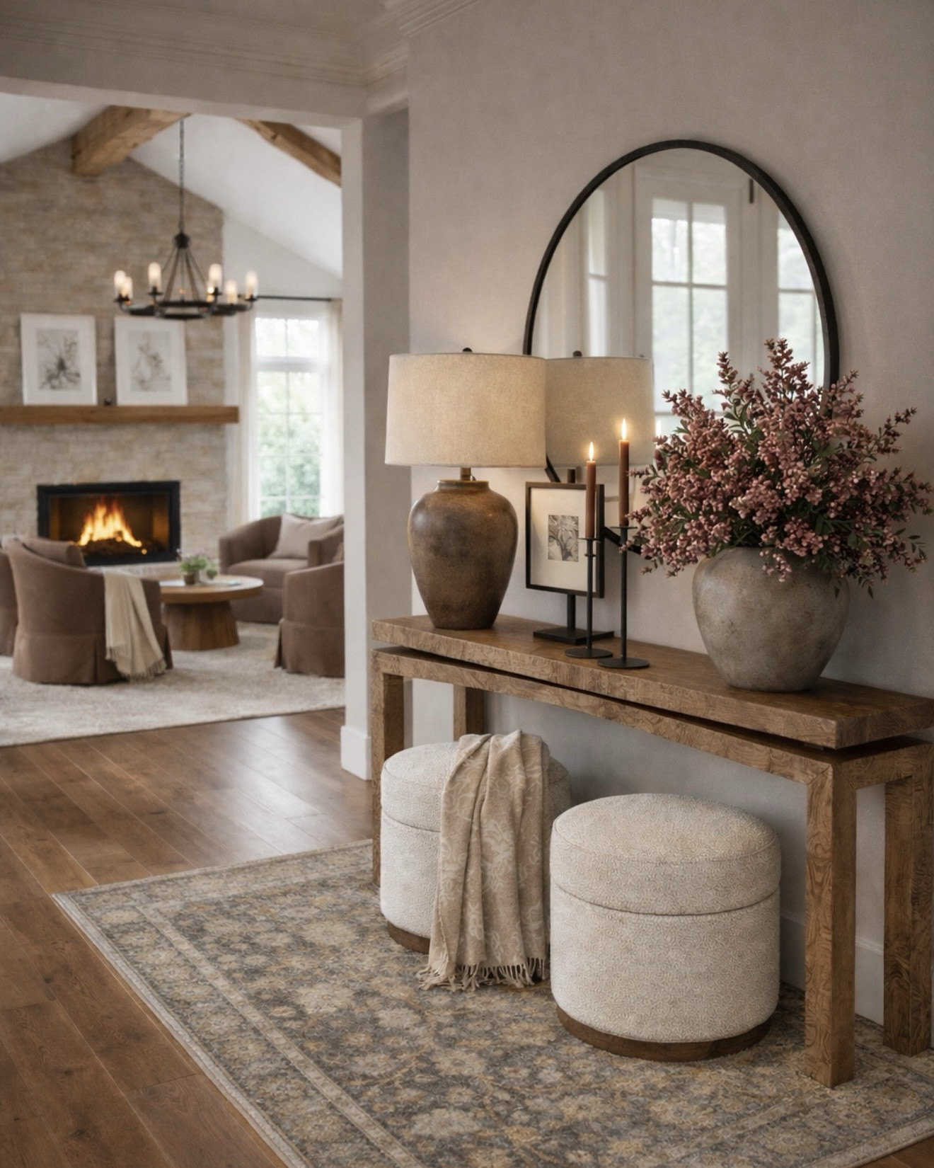 Warm Neutral Entryway with Wood Console Table 

Follow @farmtotablecreations on Instagram for daily home styling + decor finds 🤍

This entryway came together with the perfect mix of warm wood, soft neutrals, and simple textures. The solid wood console table anchors the space, layered with a chunky ceramic lamp, minimal framed art, and iron candleholders for a collected, designer feel. I love adding florals in a stoneware vase to soften the look and bring in subtle color, while the round ottomans tucked underneath add both function and texture. The vintage-inspired rug grounds everything and helps the entry flow seamlessly into the living room beyond. Classic, cozy, and timeless — exactly how I love an entryway to feel.

#entryway #entrywaydecor #consoletable #woodfurniture #neutralhome #modernorganic #homedecor #rug #roundottoman #tablelamp #mirror #candleholders #florals #cozyhome #homeinspiration

#LTKFindsUnder50 #LTKHome #LTKSaleAlert