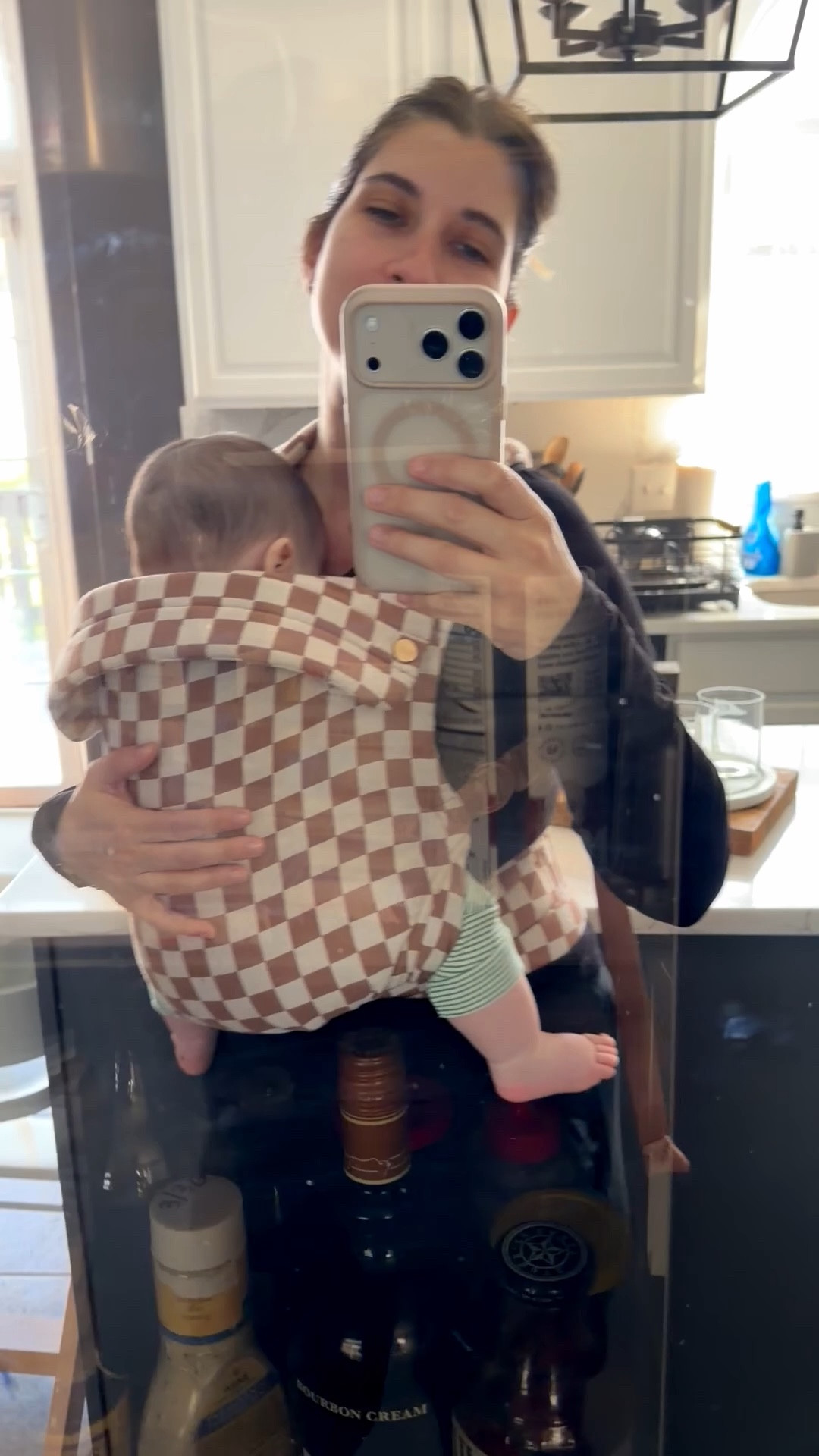 i tried out a few, but this is by far my favorite baby carrier yet. This print is mocha check, and yes, I'm using my refrigerator as a mirror lol￼

#LTKBaby #LTKBump #LTKmomlife