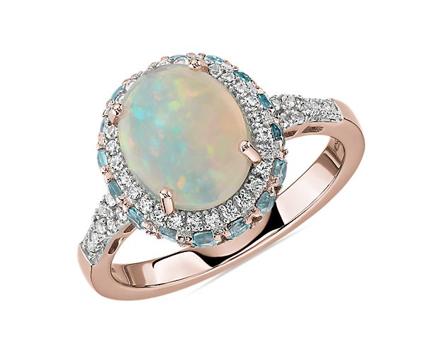 Oval Opal and Swiss Blue Topaz Halo Ring in 14k Rose Gold | Blue Nile