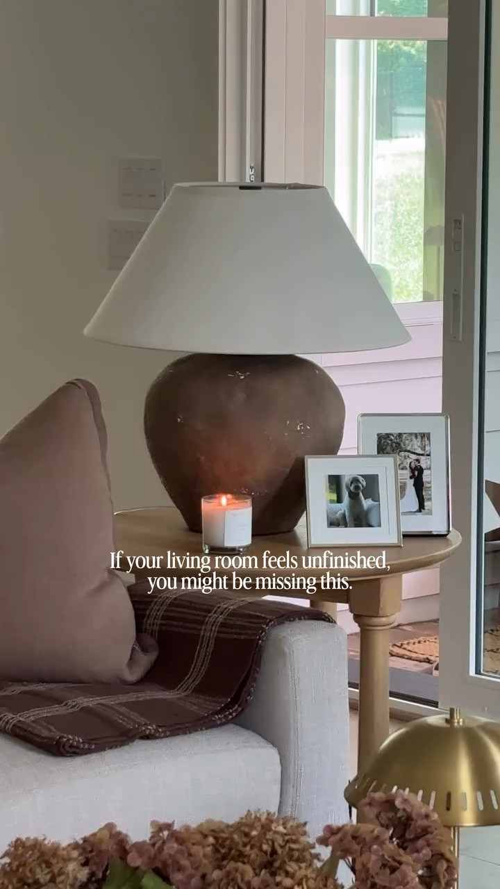 It's something as simple as a side table!!! It helps the living room space feel layered, lived in, and intentional. 

Comment shop for the links!