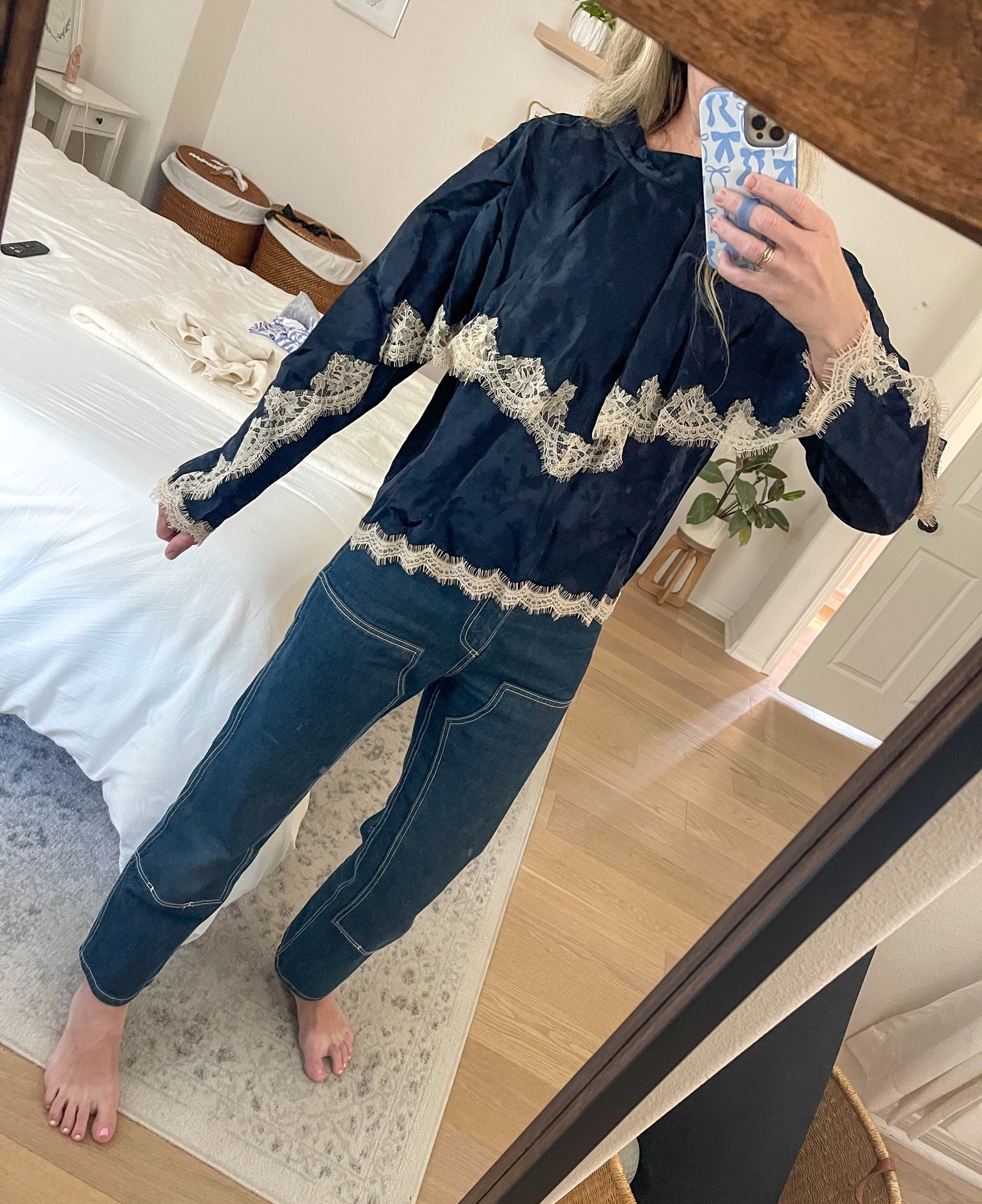 Wanted to love this top but it’s a lot less tunic-like as shown on the model on the website. I’d say size up for a more flowy fit. I’m wearing a small. Brocade-looking fabric and beautiful lace detailing. Tie at the neck.