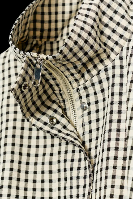 High collar bomber jacket with long sleeves. Front welt pockets. Voluminous hem with front pleats... | Zara US