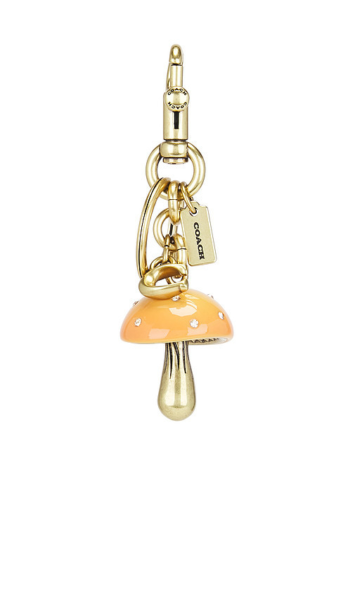 Coach Resin Mushroom Bag Charm in Mustard. Size all. | Revolve Clothing (Global)