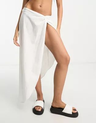 ASOS DESIGN natural asymmetric beach skirt with twist front in white | ASOS (Global)