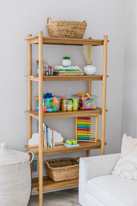 With little ones running about, keeping things tidy is a must, and this chic shelf from @walmart helps us do just that without breaking the bank (under $200 - score!). Its sleek design seamlessly blends into our home's aesthetic, adding a touch of style to the chaos of toys and games. Paired with clear bins, everything has its place, making clean-up a breeze and playtime even more fun! Tap the link in my bio for all the details. #walmartpartner #walmarthome