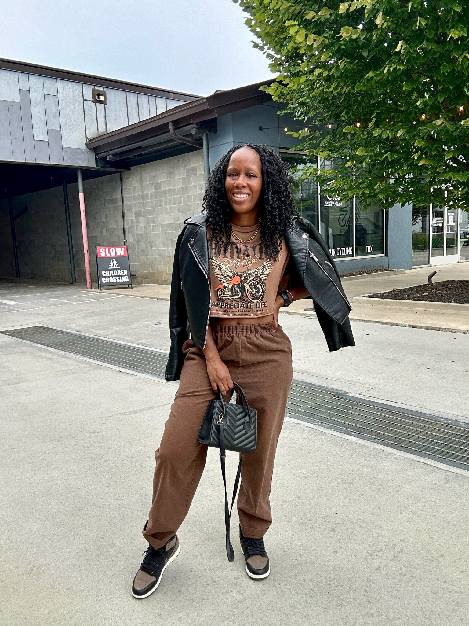Fall outfit inspo!

I’m wearing a cropped graphic muscle tee with brown pants.

I layered this outfit with a black faux leather jacket. I styled this casual outfit with a black crossbody bag and Jordan 1 Palomino sneakers.

#LTKFindsUnder50 #LTKStyleTip #LTKSeasonal