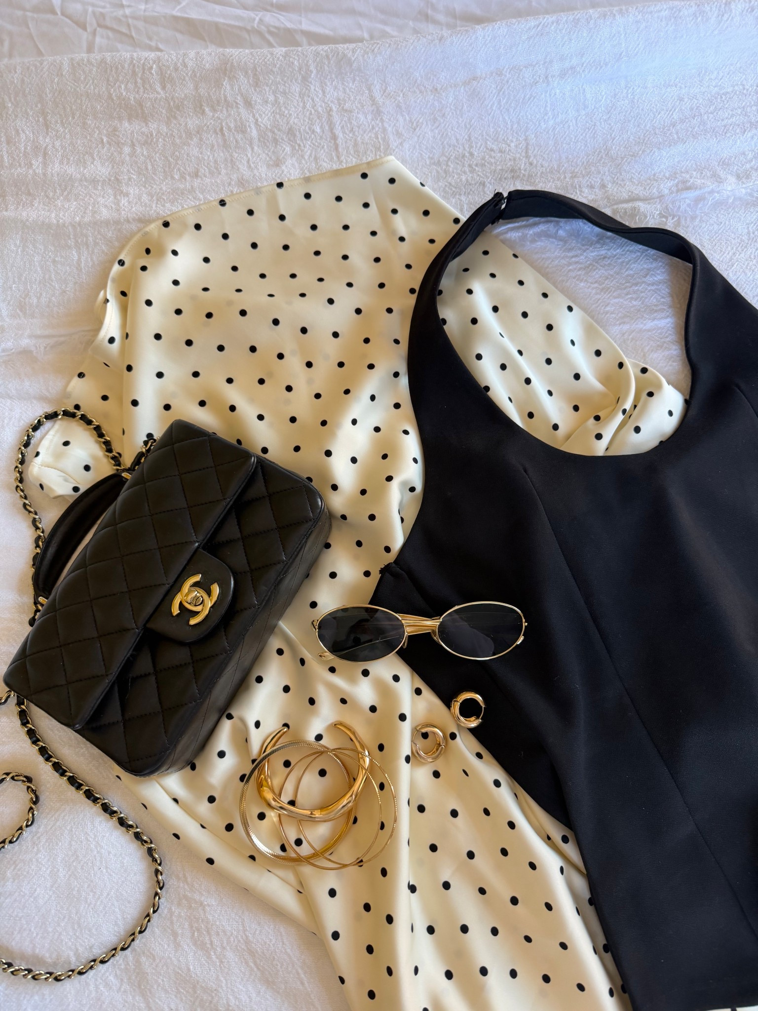 Date Night Flatlay 🤍🖤

Polka Dot Skirt Outfit, Black Halter Top, Chanel Quilt Bag,  Chic Night Out Essentials, Parisian Inspired Outfit, Minimal Black And Cream Look

#LTKsummer #LTKspring #LTKeurope