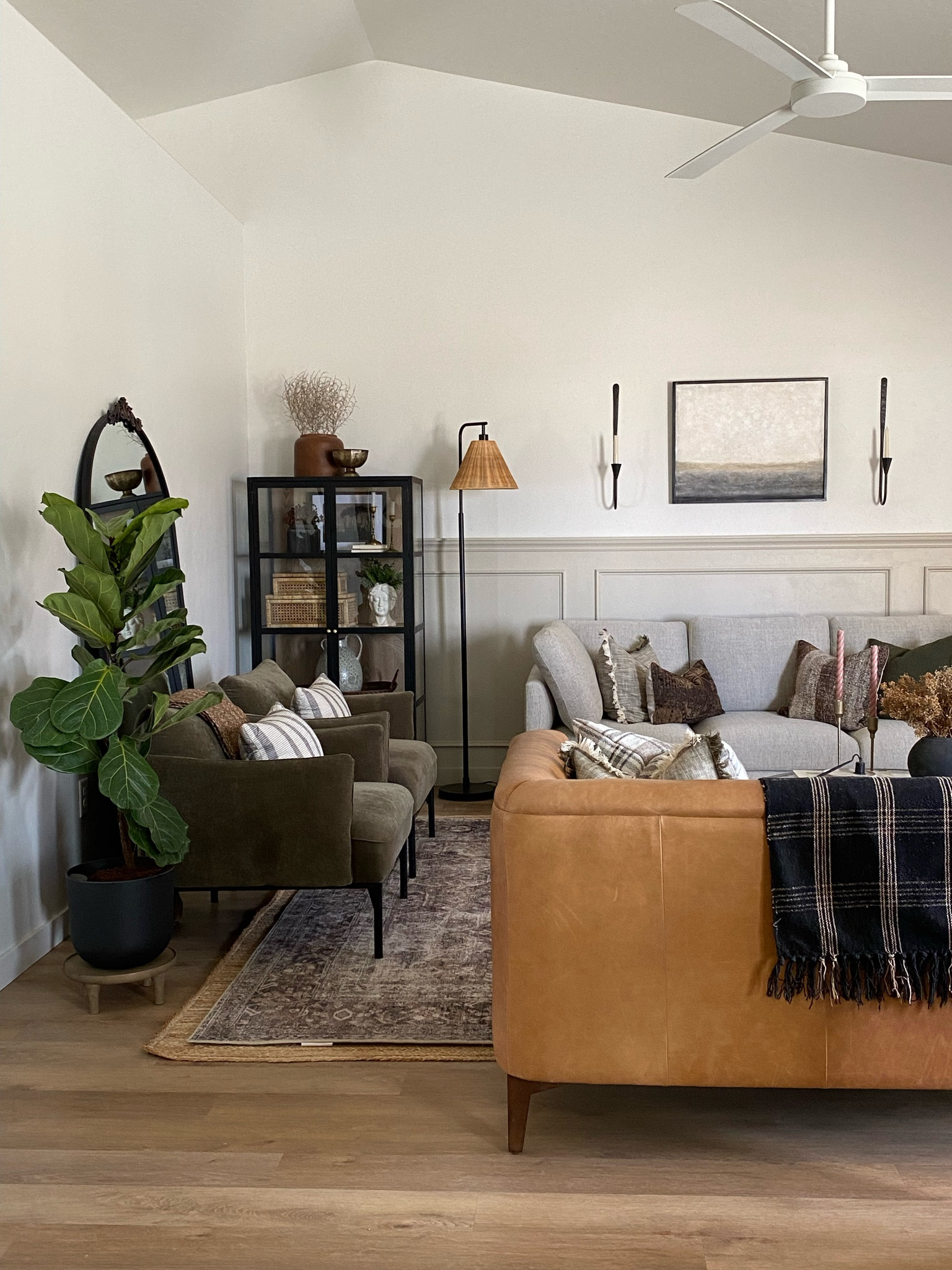 Living room inspo, custom curtains, pinch pleat curtains, floor to ceiling curtains, neutral sofa, beige sofa, west elm penn chair, green accent chair, vintage pillows, Turkish pillows, boucle pillow, shady lady tree, faux tree, greenery, Walmart floor lamp, rattan floor lamp, round coffee table, wall sconce, tapered candle holder, leather sofa, shady lady tree, loloi Sinclair rug, throw pillows, floor length mirror, arch mirror, Target home decor, affordable home, black cabinet, studio McGee cabinet, round glass coffee table, target accent table, Sinclair loloi rug, vintage inspired rug 

#LTKstyletip #LTKhome #LTKunder50