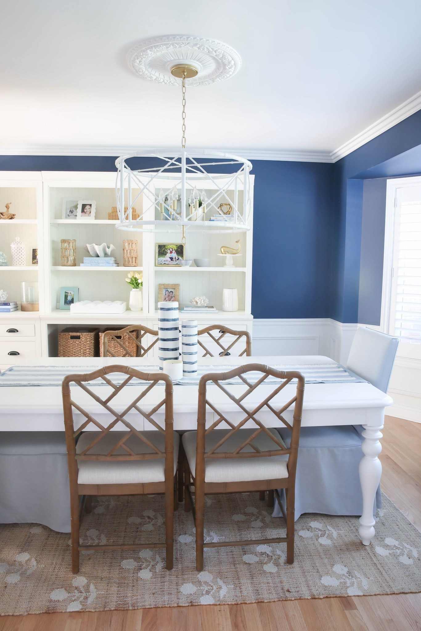 This coastal dining room with blue walls, a white bookshelf, and curated coastal accents is bright, beachy, and full of designer-inspired style. I love how the deep blue paired with crisp white furniture and seaside decor makes every meal feel elevated and relaxed. 

#LTKSaleAlert #LTKHome #LTKU