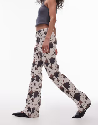 Topshop mid rise 90s flare jeans in cow print | ASOS (Global)