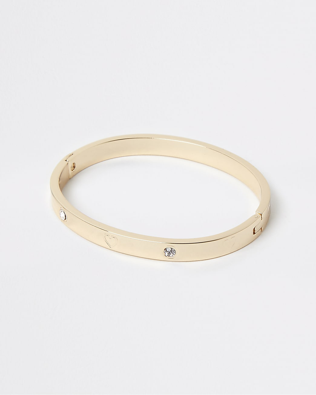Gold stainless steel heart cuff bracelet | River Island UK & IE