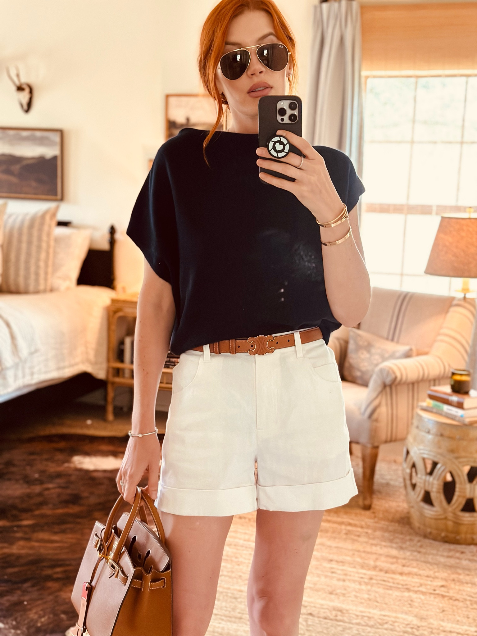 These cotton/linen shorts have been perfect for summer - cool, casual and effortless. They are tailored so I can wear to work/professional settings, but also relaxed and can wear to the beach, so versatile. I paired with this navy sweater for a more nautical look, will be packing for my upcoming vacation⚓️