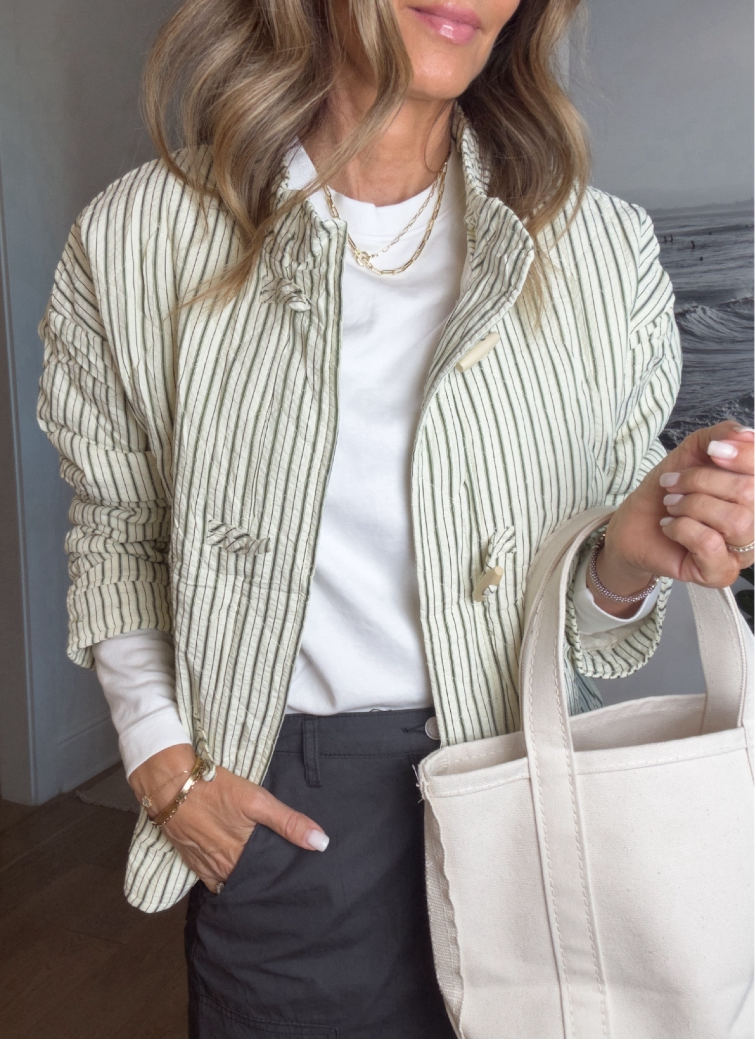 -Amazon quilted jacket with toggle buttons. Color is a cream with green. Other colors available. I have sleeves pushed up. So good! 
-a favorite long sleeve tee. Wearing a S, TTS
-Target cargo skirt in a second color. Size down. 
-new balance sneakers 
-structured canvas bag, will stand up by itself. 

#LTKFindsUnder50 #LTKStyleTip #LTKOver40