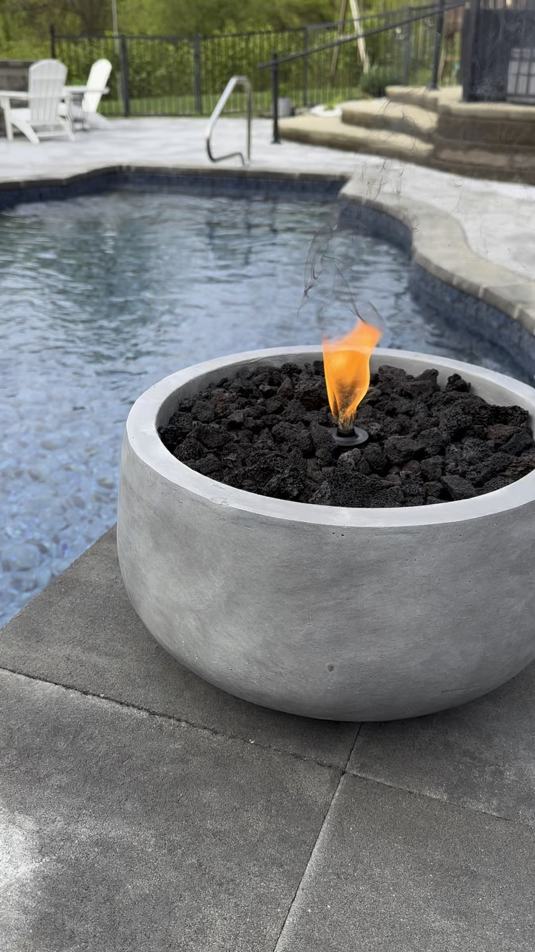 This was SO simple to make, and you save hundreds by making it yourself! ✨ 

You only need 3 things:

👉🏼 A concrete planter (I got one with a 15.7” round one with a hole in the bottom so when it rains the water drains thru)

👉🏼 lava rocks (I used 3 bags)

👉🏼 a tabletop tiki torch  

#LTKhome