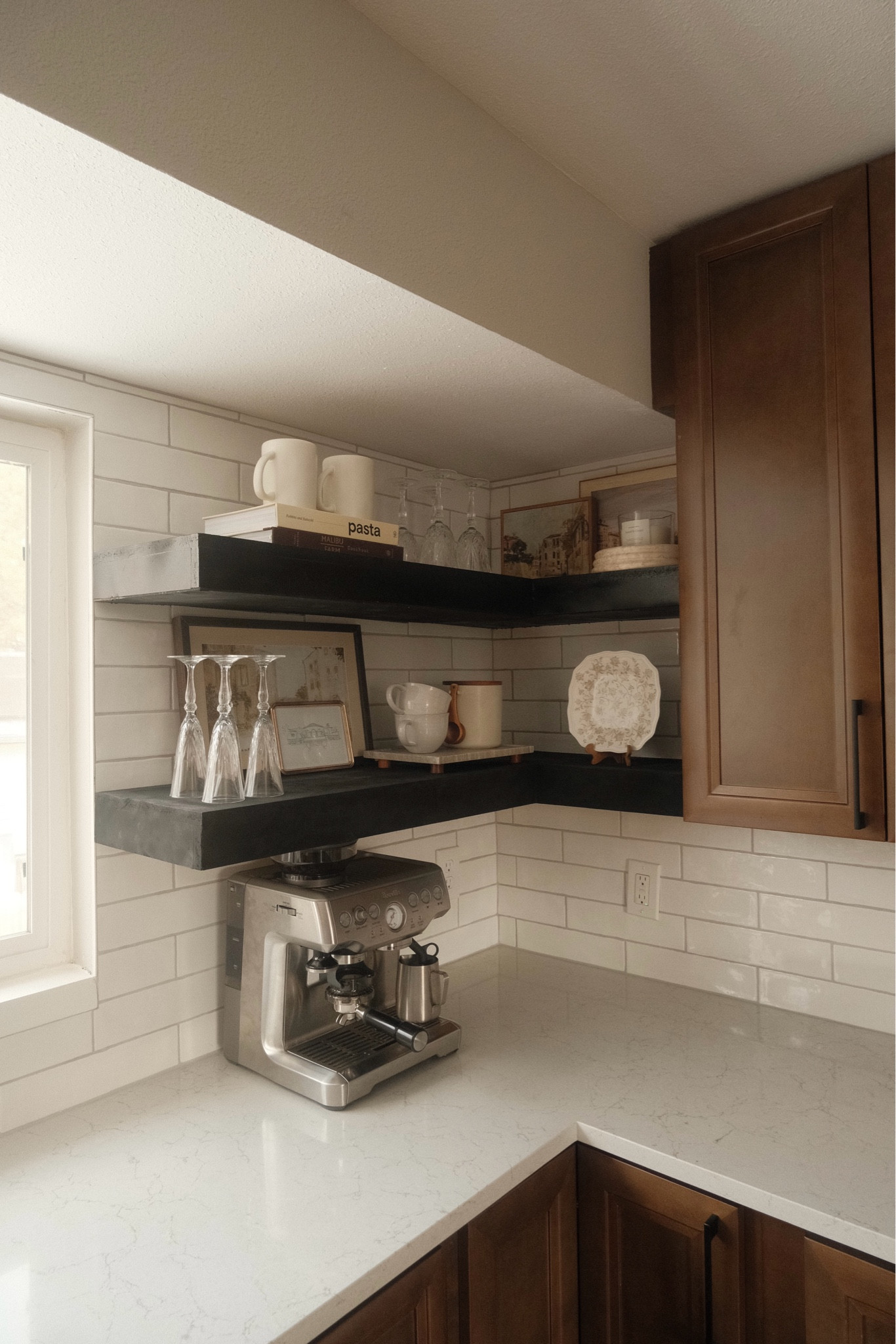 Trying to fill my kitchen shelves with items that mean a little something to us rather than just random decor 🫶🏼 Lots of thrifted items, European art, framed sketch of our wedding venue, wedding glassware, and coffee of course! 