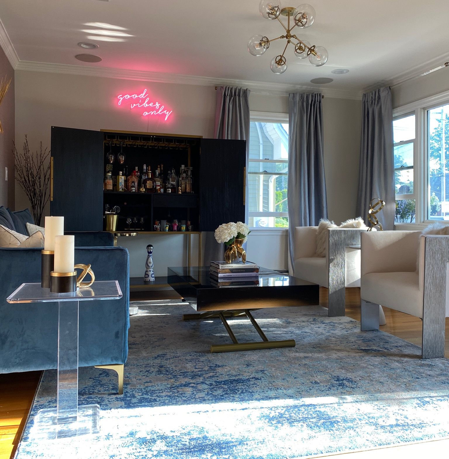 Neon sign for your living room makeover! Black coffee table, navy velvet sofa, accent chairs and modern area rug!

#LTKstyletip #LTKhome #LTKFind