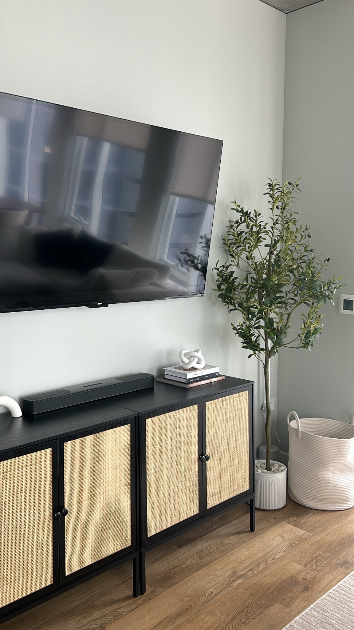 the best tv stand that also holds tons of storage!! #neutralfurniture #modernapartmentdecor #naturalmodern #cabinettvstand #livingroomdecor