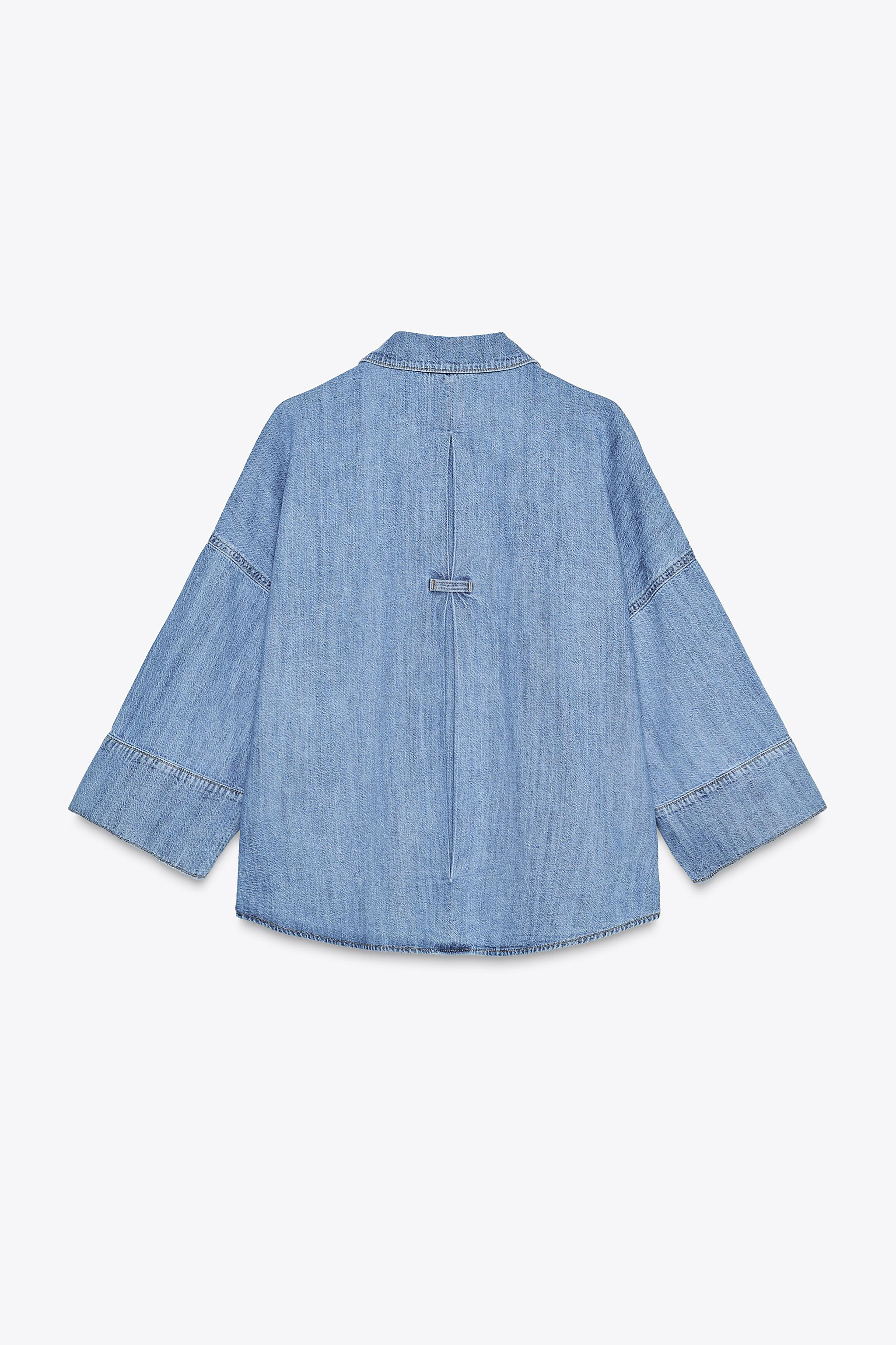 Lapel collar shirt with V-neck and wide, below-the-elbow sleeves. Asymmetric hem. Front metal but... | Zara US