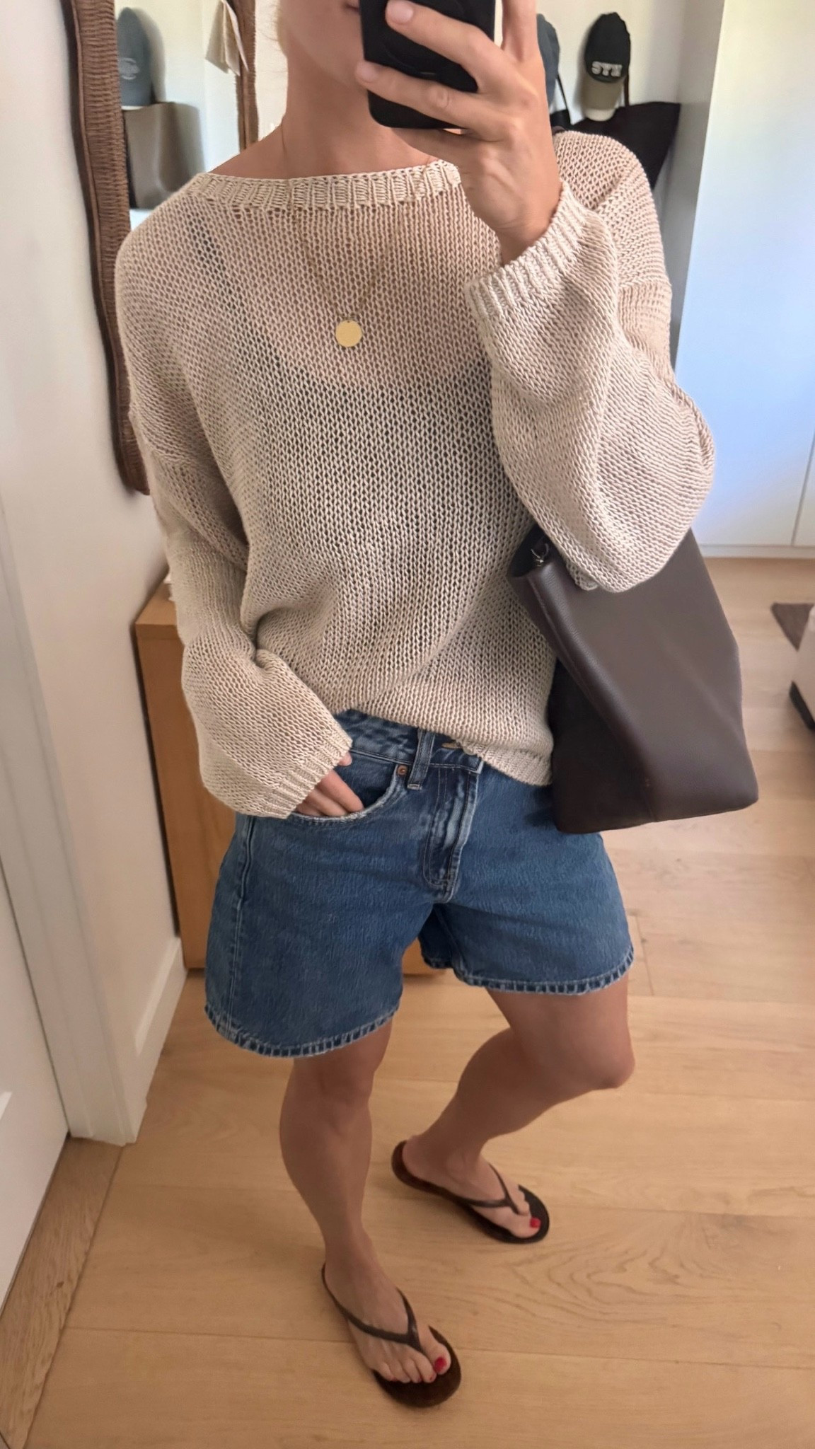 Cute and relaxed summer outfit with open knit sweater, denim shorts, and jelly flip flops. Love this oversized leather tote too!

#LTKsummer #LTKcanada #LTKshoes