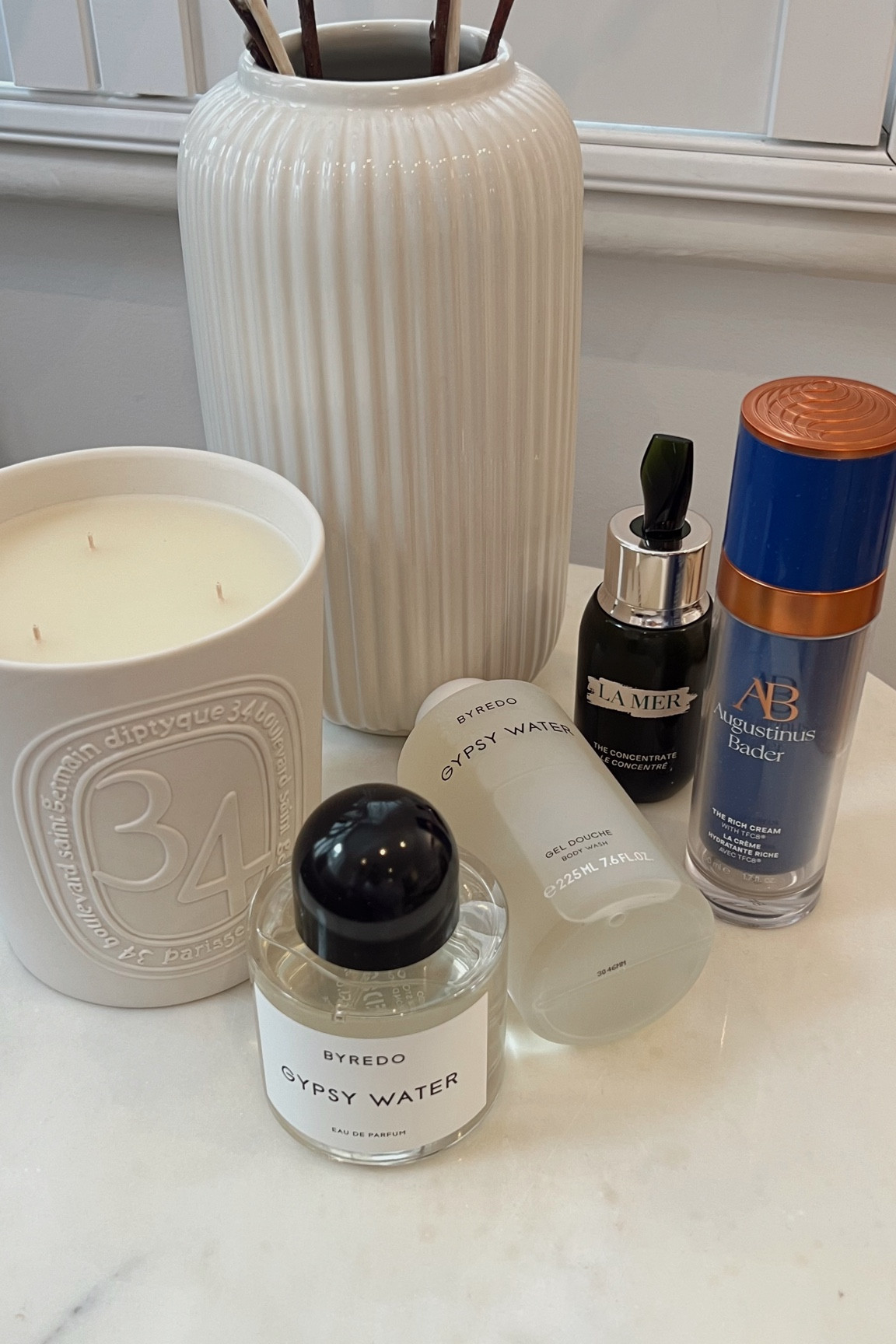 SpaceNK haul - diptyque 34 candle, byredo gypsy water perfume and body wash, la mer concentrate & augustinus bader the rich cream  

#LTKeurope #LTKGiftGuide #LTKbeauty