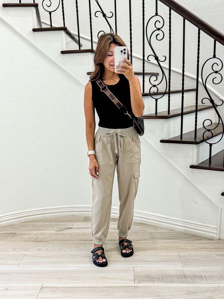 Cargo pants in small, color Khaki(lightweight, quick dry, roomy pockets, comfy).
Black tank top in small tts.
Black sandals fit tts.
Black belt bag, is linked too.
Casual Outfit, travel outfit, airplane outfit, travel style, outdoor exploring, spring outfit, summer outfit, Amazon finds, sandals, white sneakers, fashion over 40, petite style.

#LTKstyletip #LTKover40 #LTKfindsunder50