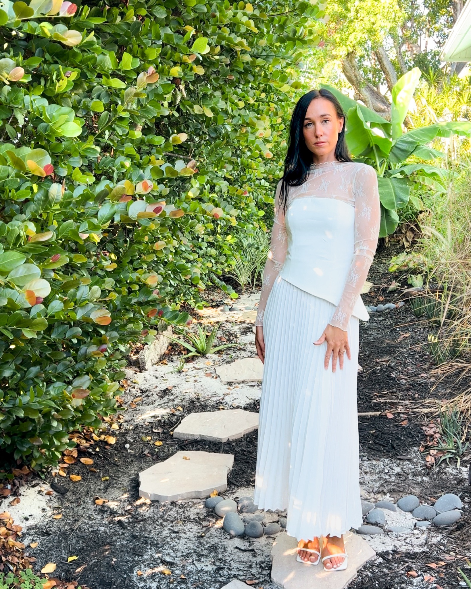 “Romanticizing my own backyard… because why travel far when beauty surrounds you right at home? 🌿💫

I’m absolutely in love with this dreamy outfit, a blend of ethereal elegance and modern romance. The delicate lace bodice, with its intricate sheer sleeves, adds a touch of whimsy and femininity that feels both classic and fresh. Paired with a pleated skirt that flows with every step, it feels as though I’m floating through my own little garden escape. And can we talk about that side slit? It’s just enough to keep things interesting without losing that effortless grace.

This look is perfect for anyone who loves to blend sophistication with a hint of allure. Whether it’s a garden party, a casual evening gathering, or even just a moment to feel beautiful at home, this outfit is made for creating memories (and Instagram moments!). 🌸

If you’re ready to embrace your own fairytale moments and elevate your wardrobe with something timeless yet bold, this is your sign. Tap the link in my bio to shop the look! 💫✨ #RomanticStyle #BackyardElegance #EtherealFashion #SheerLace #PleatedSkirt #OutfitInspo #EffortlessElegance #GardenVibes #StyleYourStory #OutfitOfTheDay #FashionForTheDreamers #WeekendWander #EleganceInTheEveryday #ShopTheLook #DreamyFashion #FallTrends2024