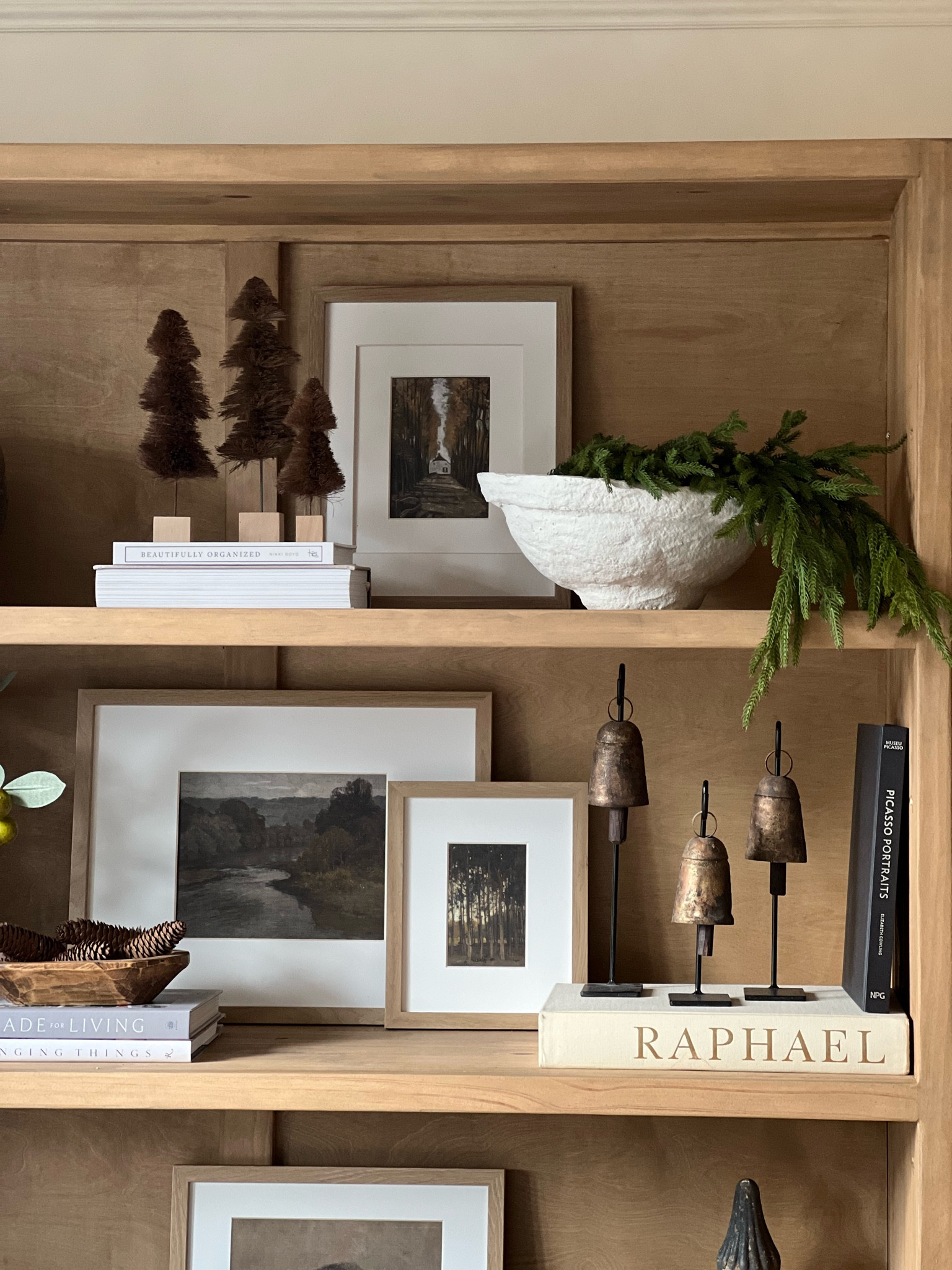Easy Christmas shelf decor

Brown sisal trees
Norfolk pine stems
Vintage hanging bells
Light wood gallery frames

#LTKhome #LTKHoliday