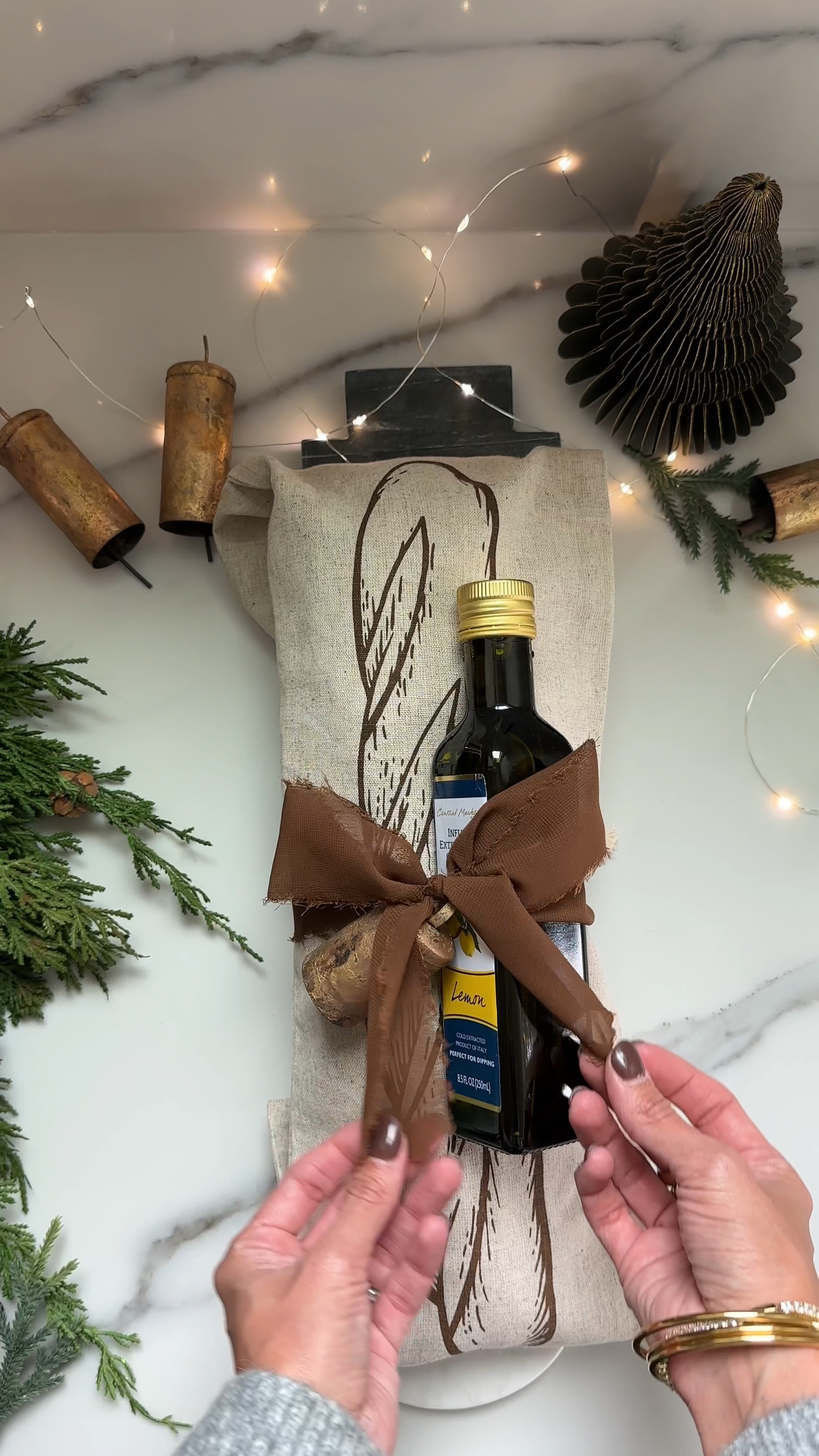 The cutest gift idea that’s yummy too! A beautiful marble tray that’s perfect for decor or as a charcuterie board during the holidays. Gift a baguette paired with your favorite olive oil and done! So easy but super presentable and yummy too. 

Holiday Bread Gift | bread bag  olive oil  snowman bread  marble snowman  brown ribbon  vintage bell  holiday gift  bread loaf  holiday bread set  hostess gift

#LTKHome #LTKGiftGuide #LTKWatchNow