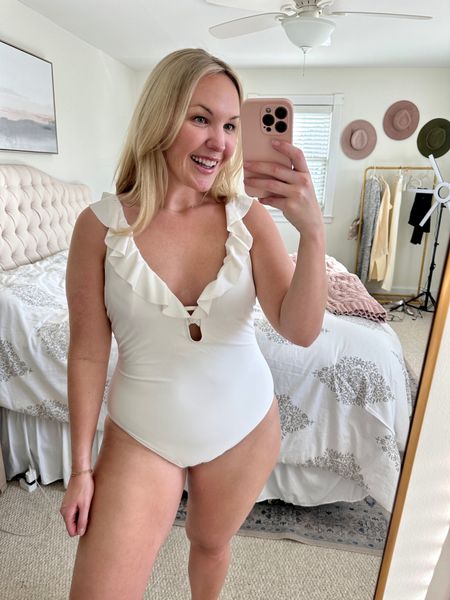 Loving the ruffle detail on this white one piece bathing suit! This would be really cute for a bride/honeymoon trip 🥰 I’m wearing a large  

#LTKmidsize #LTKSeasonal #LTKswim