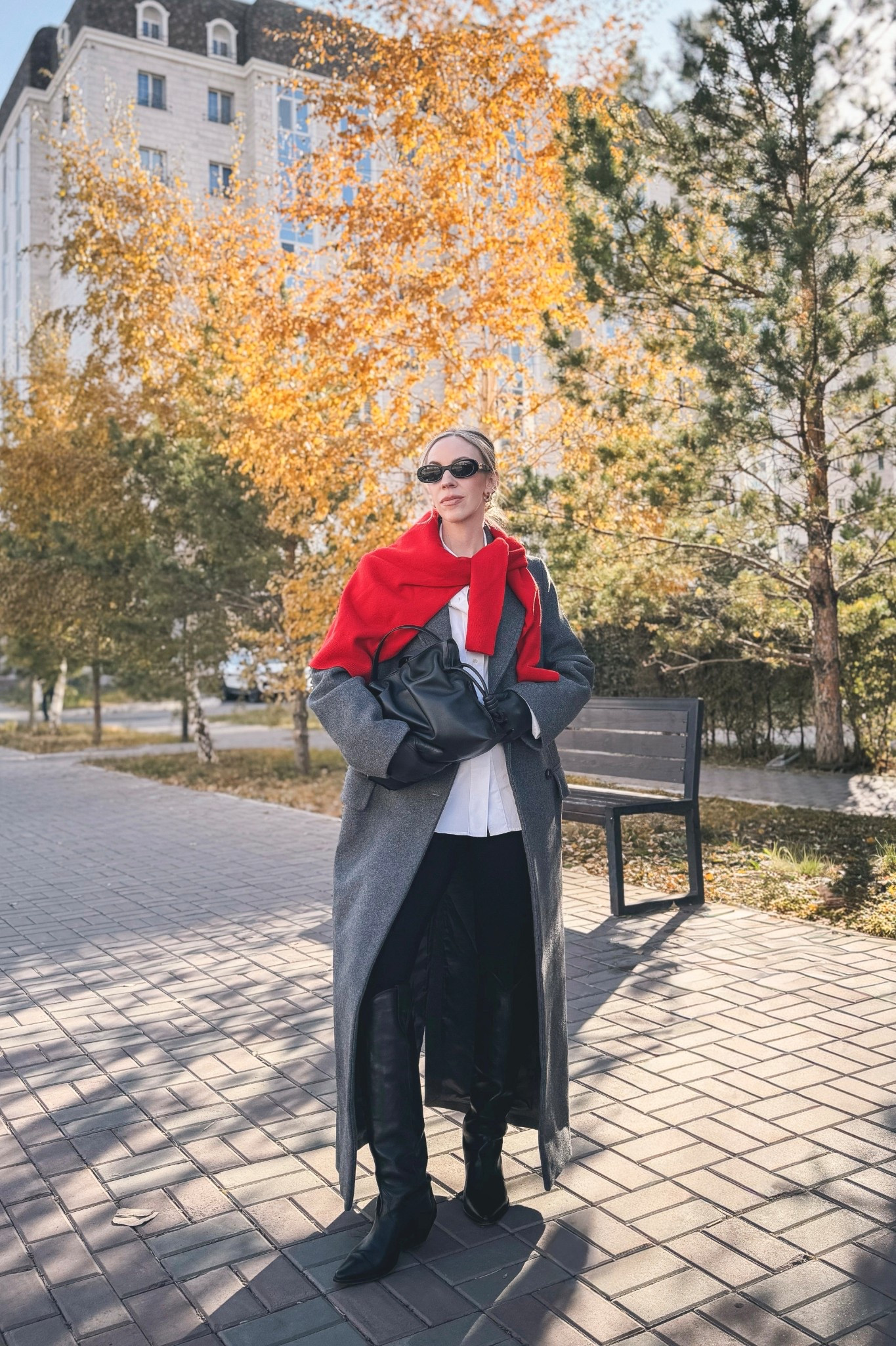 Gray double breasted wool coat, gray and red, sweater over shoulders, black western boots, Loewe Flamenco pouch handbag

#LTKOver40 #LTKSaleAlert #LTKSeasonal