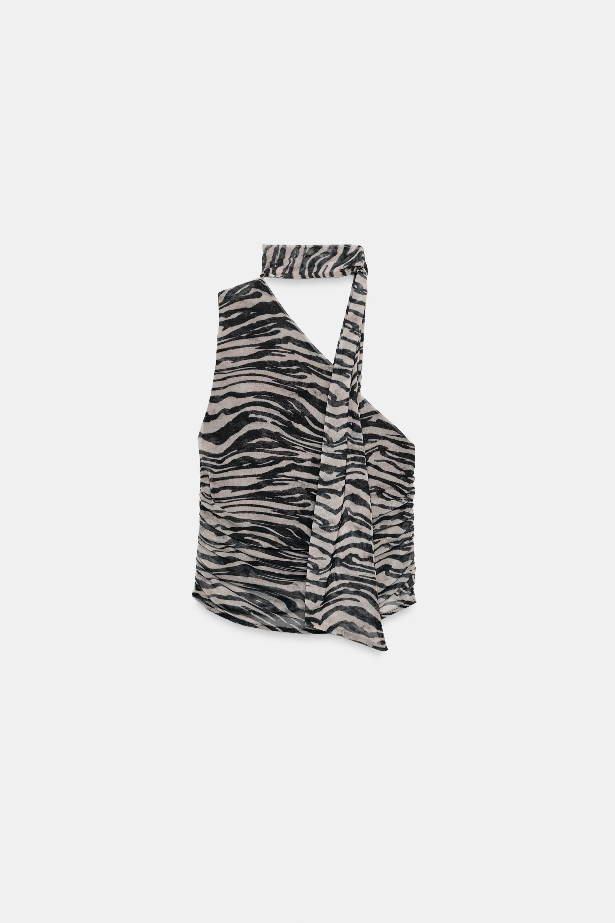 Model height: 178 cmAsymmetric neckline sleeveless top. Featuring matching fabric scarf detail an... | Zara UK