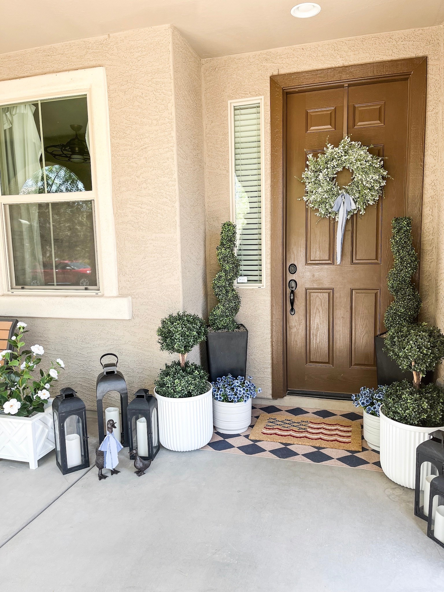 Early summer porch!

With summer on the way I added lots of greenery, touches of blue, an adorable patriotic doormat, and these sweet little ducks to welcome you in. This beautiful wreath gives all the fullness and the added blue ribbon adds the perfect touch!

#frontporch #porchdecor #homedecor #summerporch #summerdecor #summerwreath

#LTKSeasonal #LTKHome #LTKSaleAlert